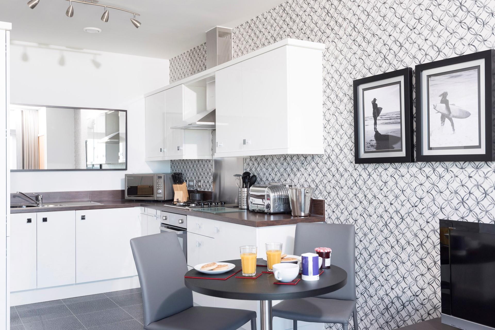 The kitchen area is well-equipped and has everything you need to cook up a feast during your stay.