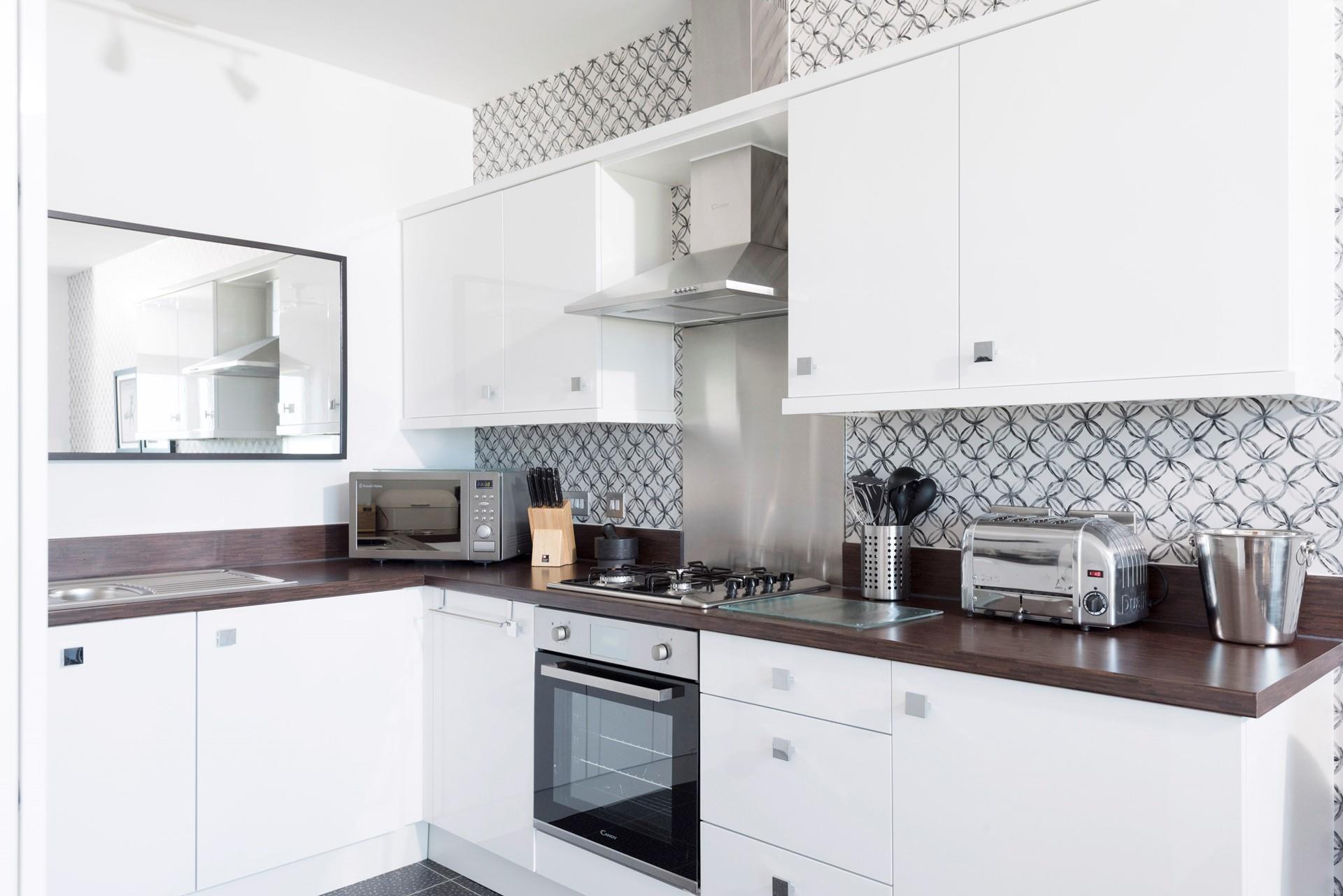 We love the kitchen's stylish design and accent wall!
