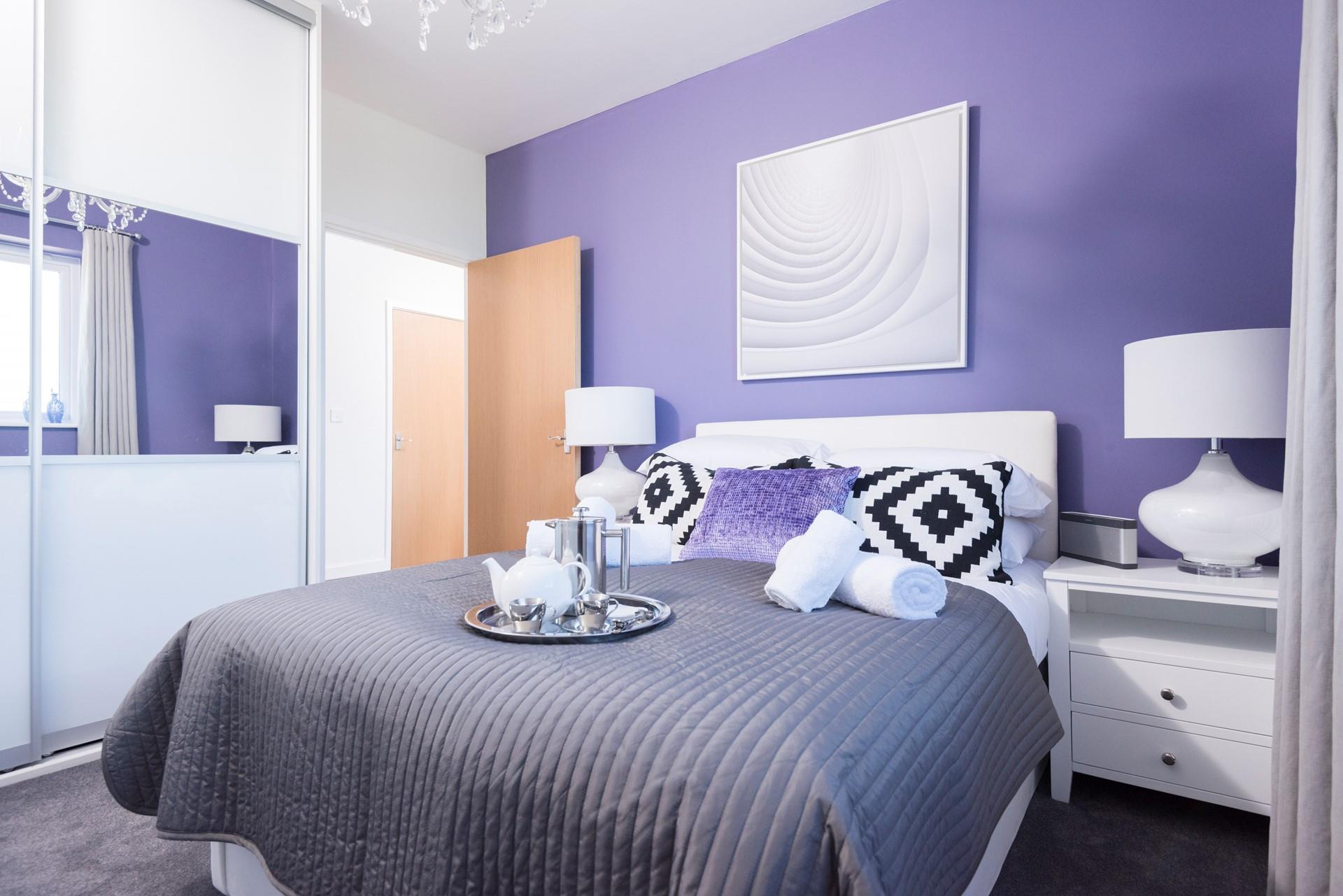 The bedroom has a sumptuous double bed and a TV/DVD player.