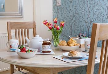 The cute dining table is perfect for enjoying a cream tea whilst discussing your evening plans.