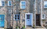 Little Breeze has a stone-faced facade with a Cornish blue stable entrance door. - Thumbnail Image