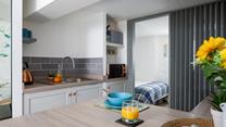 Though compact, the kitchen has everything you need to whip up delicious meals.
