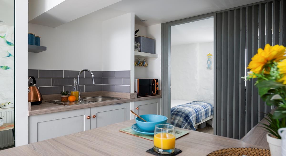 Though compact, the kitchen has everything you need to whip up delicious meals.