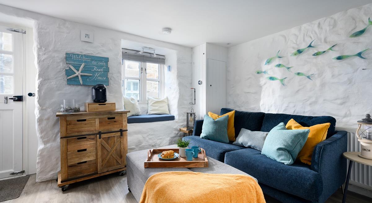 Cuddle up on the stylish leather sofa for an evening of films!