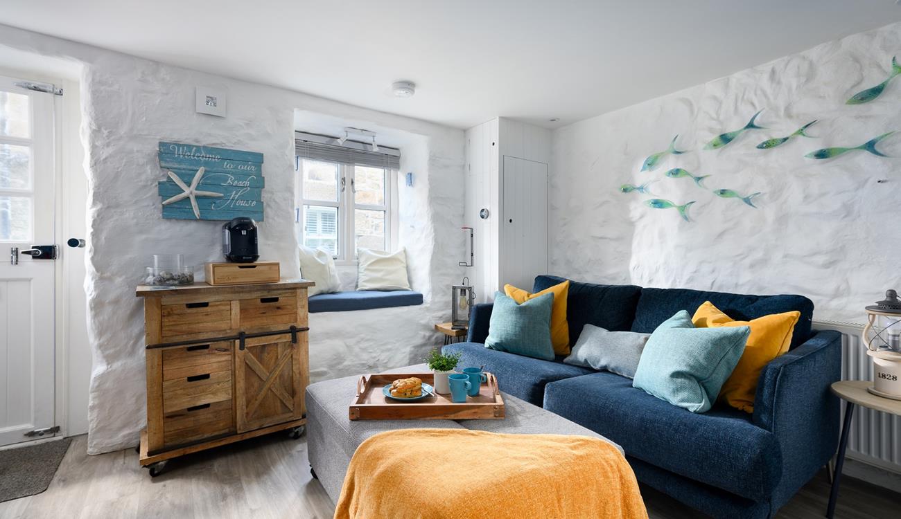 Cuddle up on the stylish leather sofa for an evening of films!