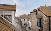 The fabulous windows allow you to look out over the incredible rooftops of St Ives to the sea glittering in the distance.  - Thumbnail Image