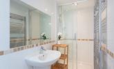 The large shower is ideal for washing away the sand after a day out on the beach! - Thumbnail Image