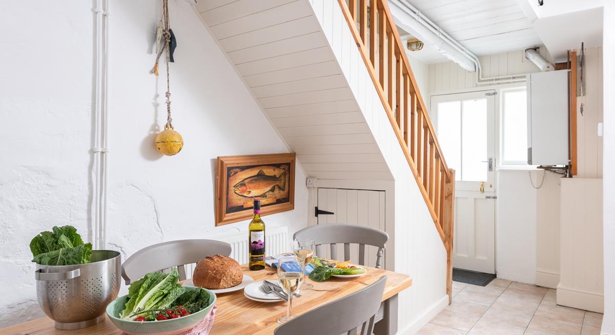 The dining area is a lovely bright space to come together and enjoy home-cooked meals as a family.