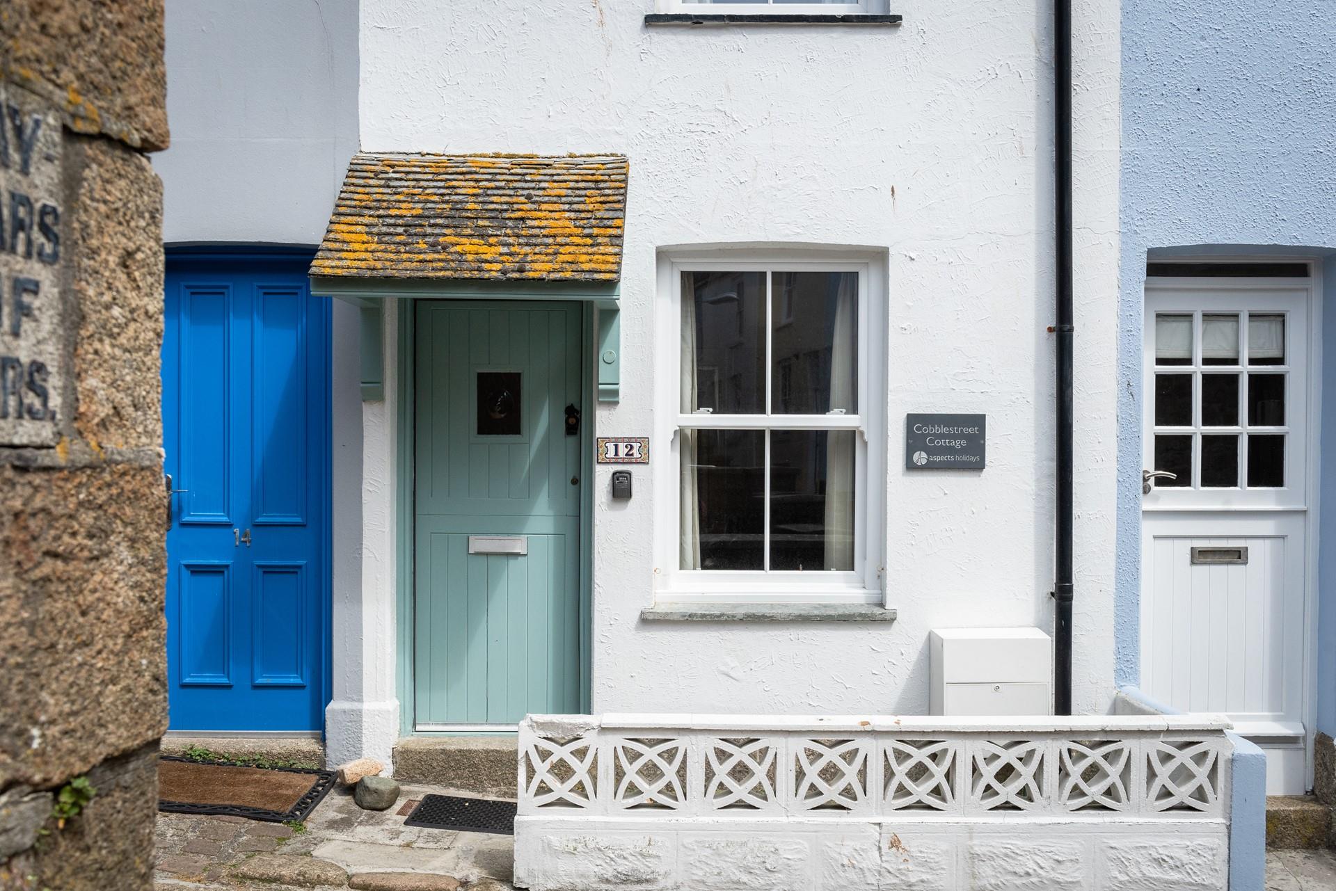 The pretty door and slate sign make the property easy to spot.
