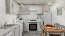 The kitchen has all you need for a relaxing stay.