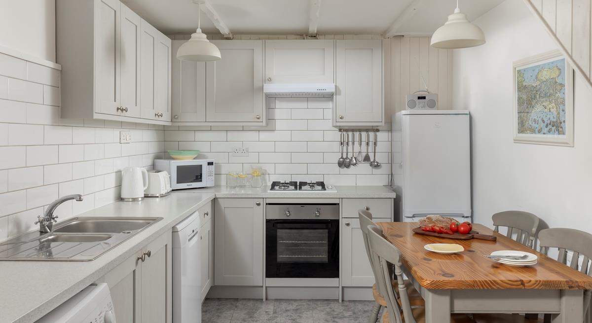 The kitchen has all you need for a relaxing stay.