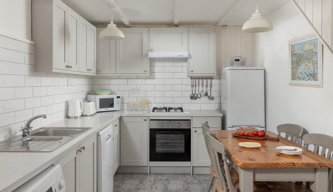 The kitchen has all you need for a relaxing stay.