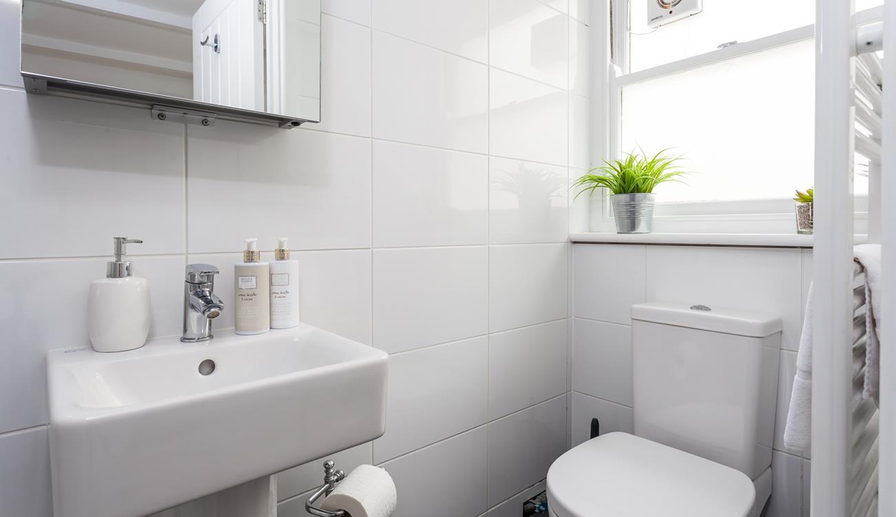 An en suite shower room offers additional privacy and space to get ready for the day ahead.