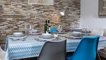 The dining table offers ample room for the whole family.