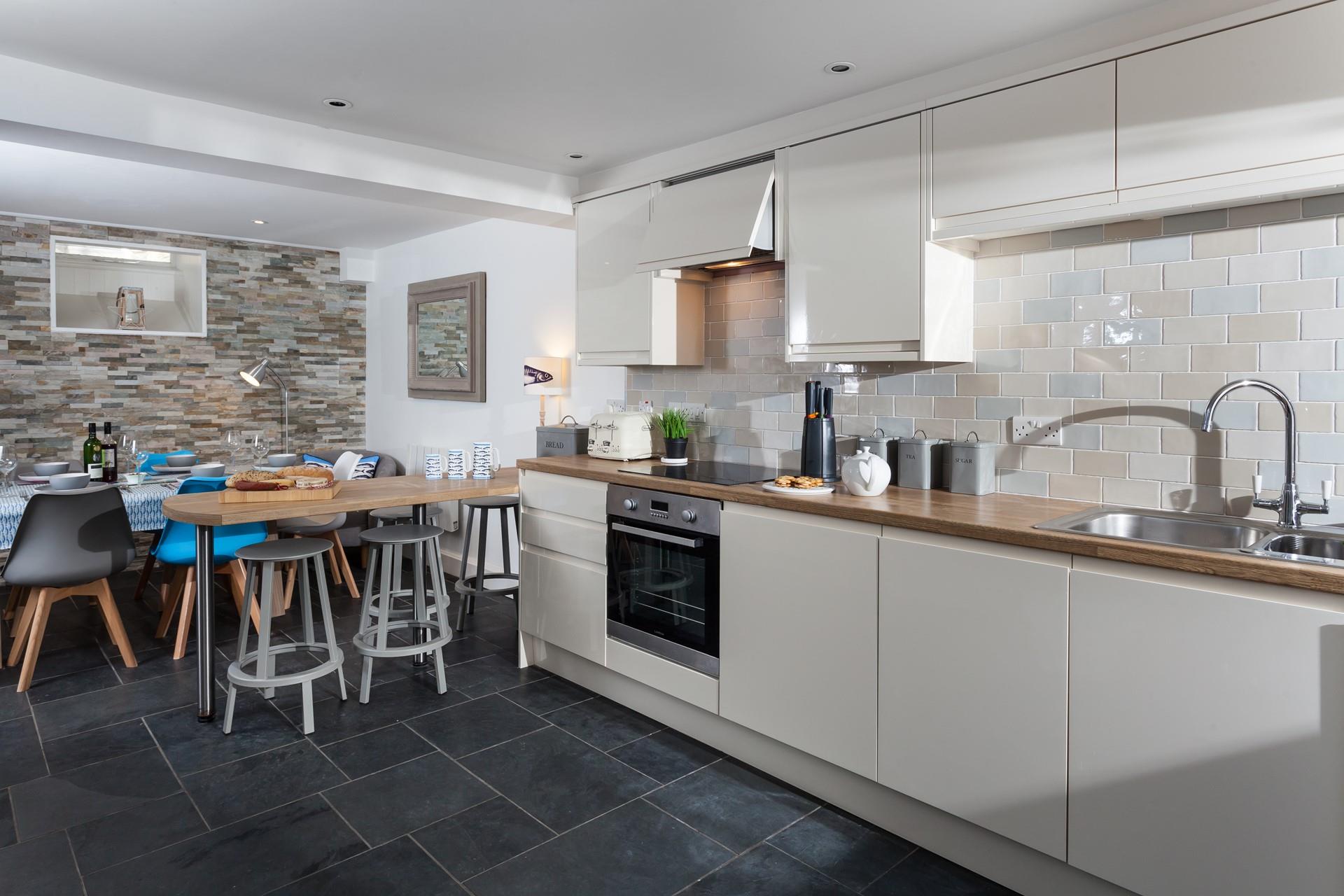 The open plan kitchen and dining area is a beautiful space for relaxing with your loved ones.