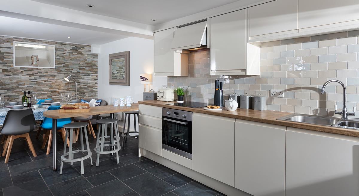 The open plan kitchen and dining area is a beautiful space for relaxing with your loved ones.