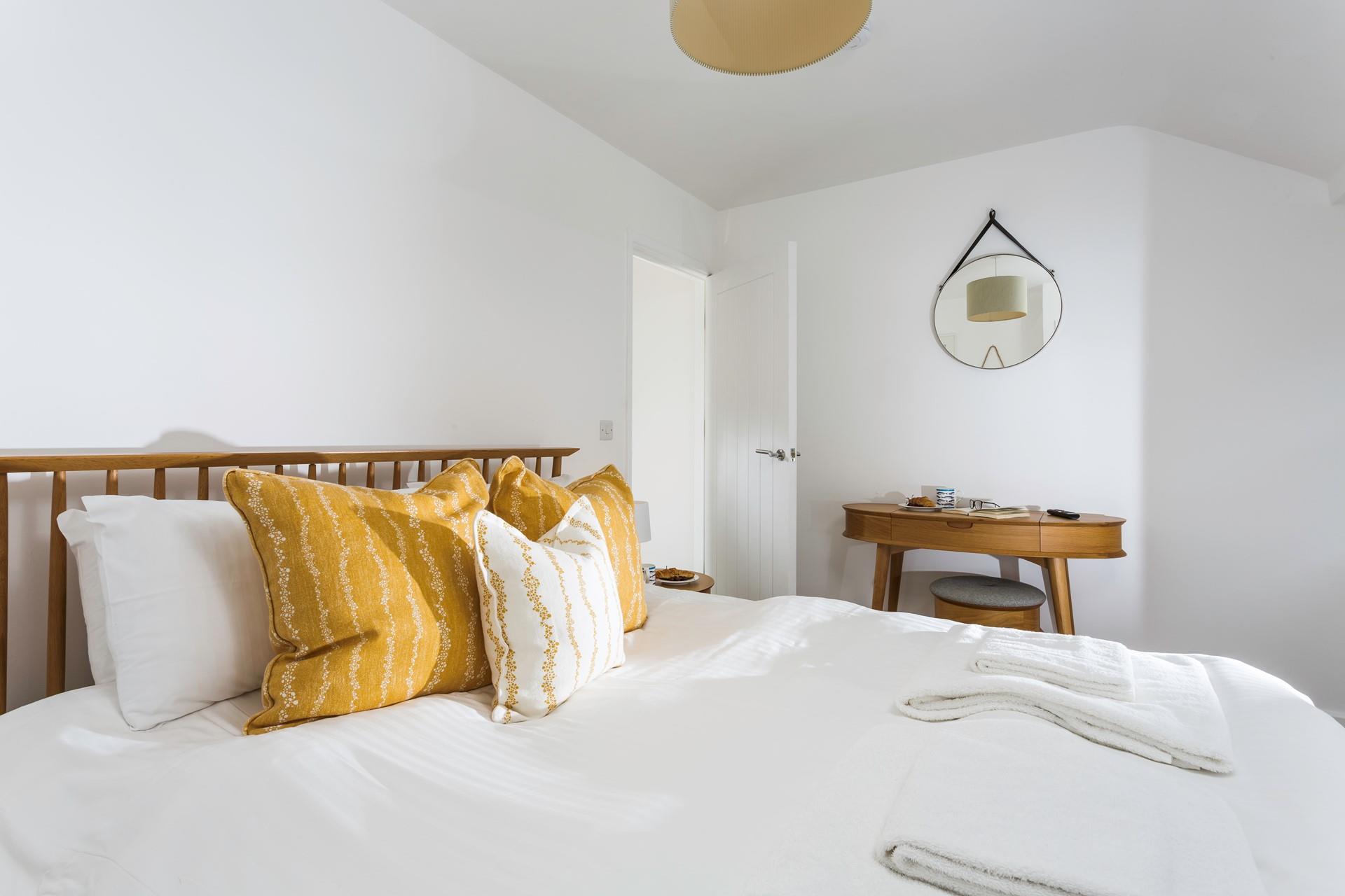 Minimalistic decor and soft tones help you to unwind before bed.