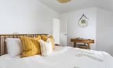 Minimalistic decor and soft tones help you to unwind before bed. - Thumbnail Image