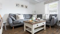 A calming colour palette makes the sitting room the perfect place to relax and unwind.
