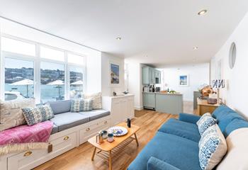 Enjoy views of the boats bobbing in the harbour while you sip tea in the living area.