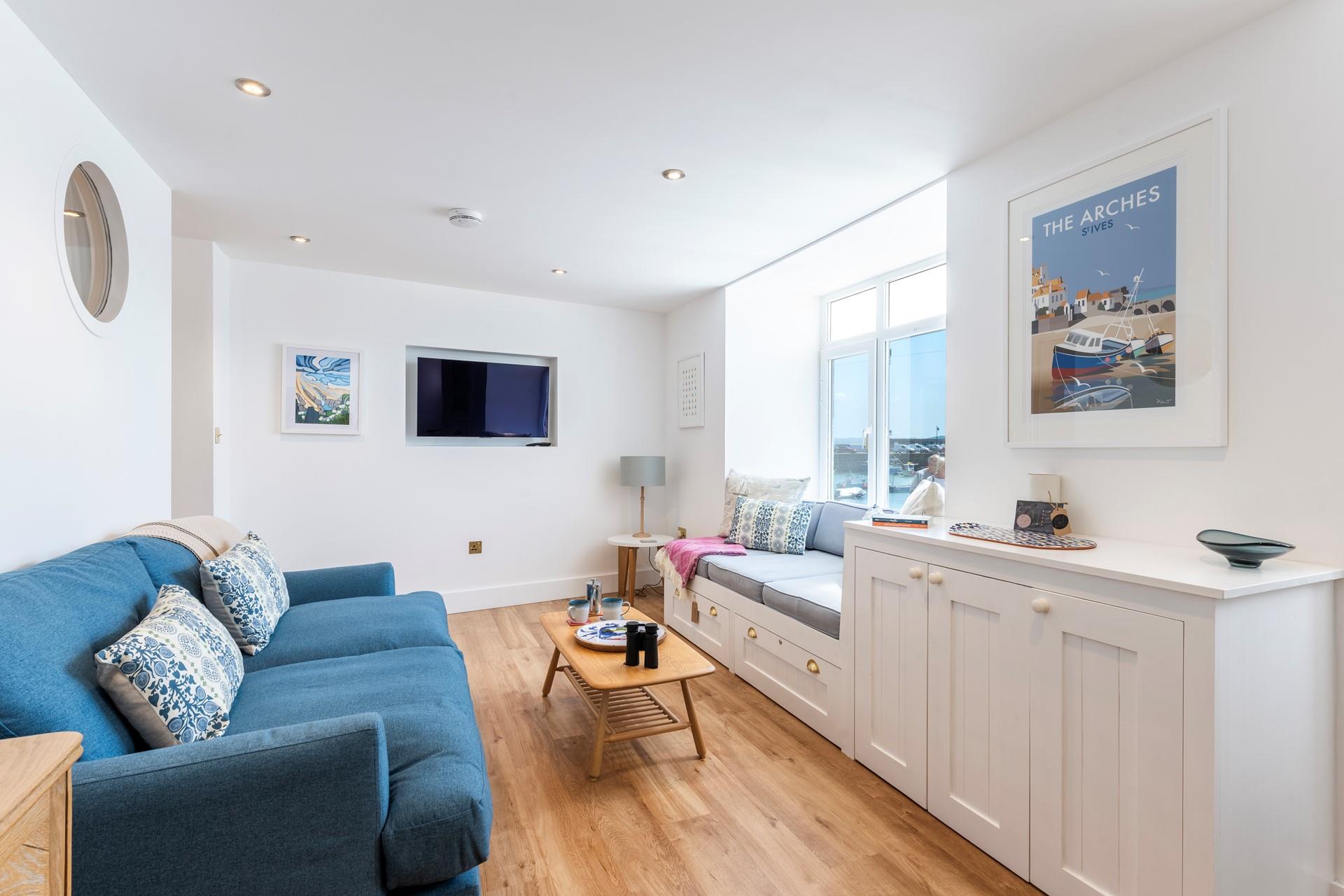 The cosy sitting room allows you to watch the world go by from the comfort of the apartment.