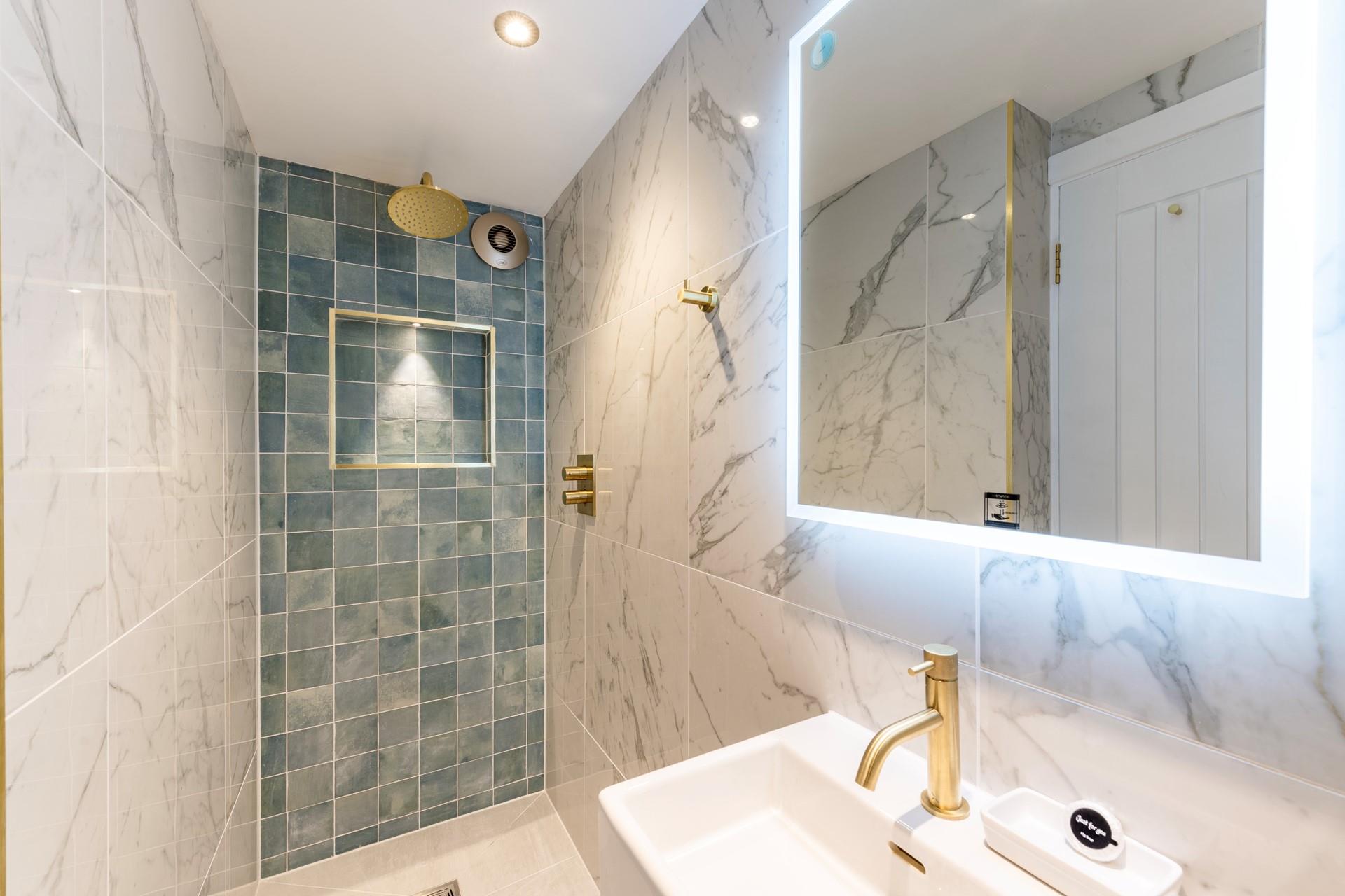 Wash off sandy toes in the shower after a day on the beach.