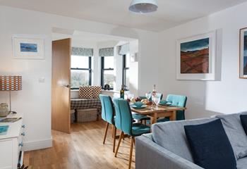 The open plan living/dining area has sea views from the window seat.