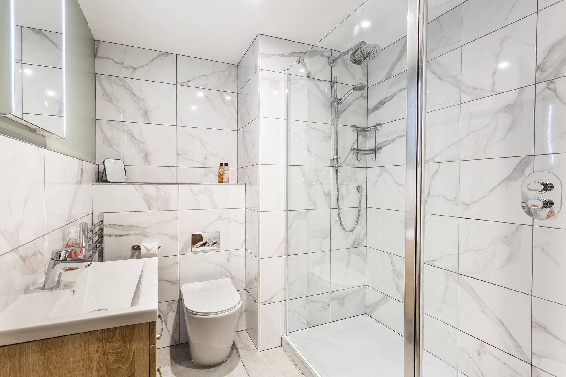 Wash off your sandy toes in the modern bathroom.