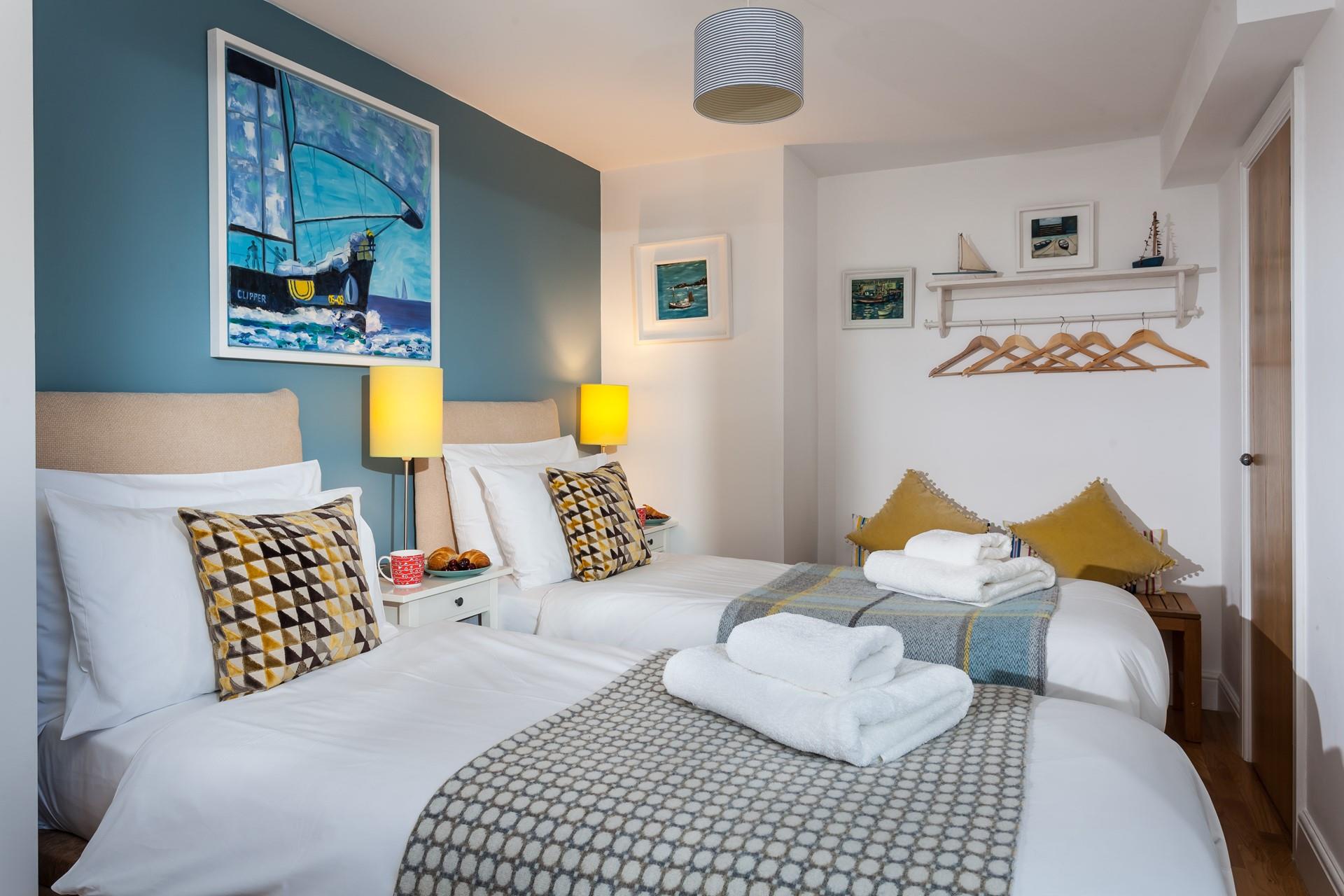 Bedroom 2 can be set up as twin beds or a super king, for flexible sleeping arrangements.