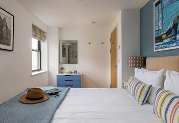 Pops of colour create a bright and welcoming bedroom.