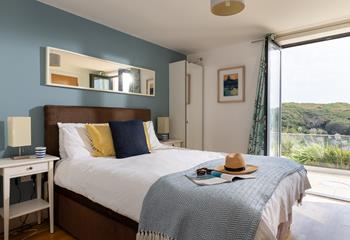 Step from the king bed, straight onto the patio, letting the fresh sea air in.