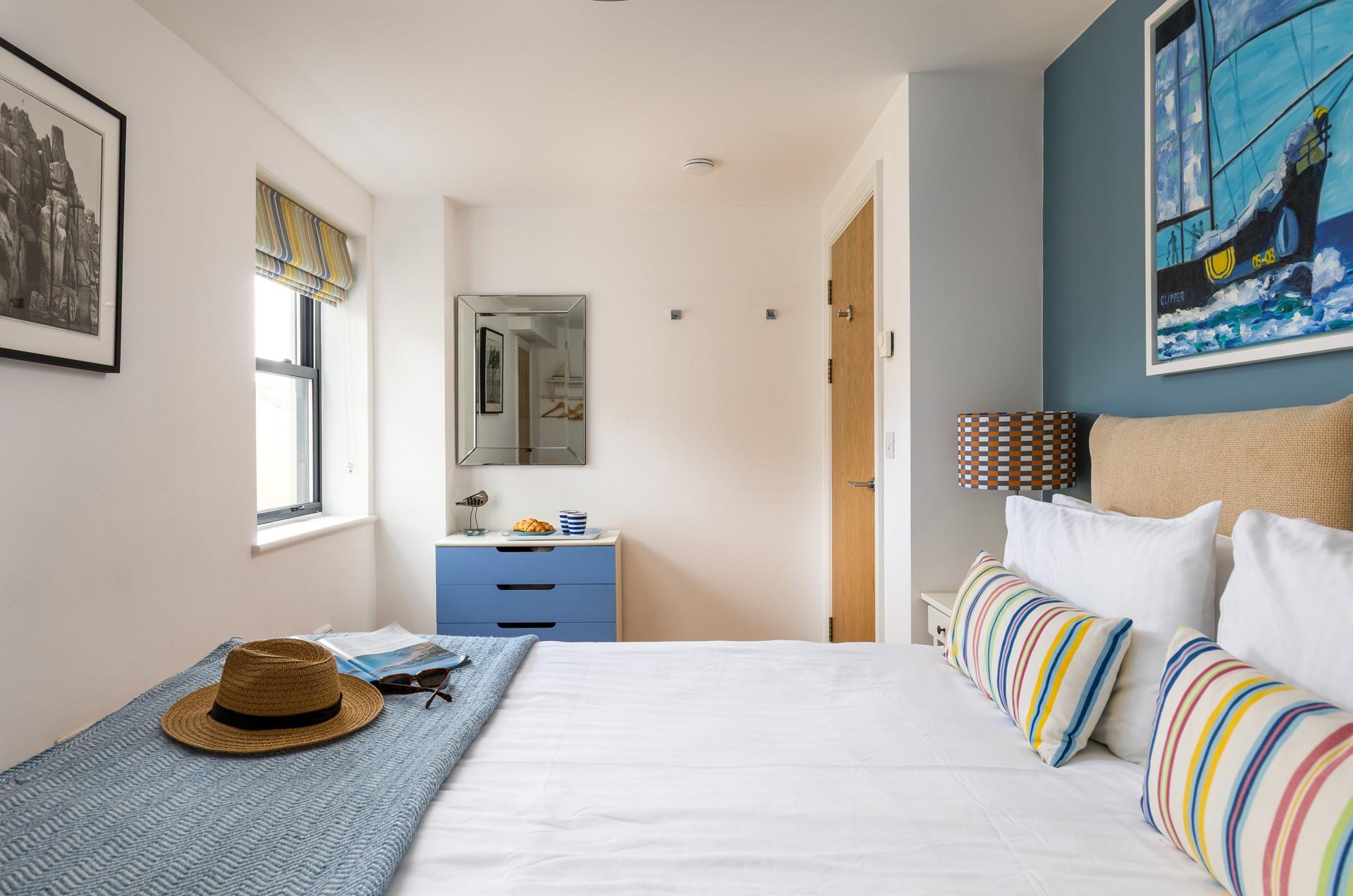 Pops of colour create a bright and welcoming bedroom.