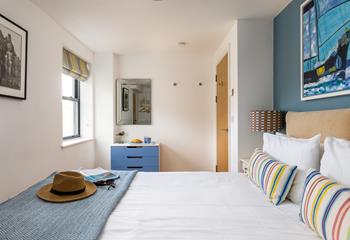 Pops of colour create a bright and welcoming bedroom.