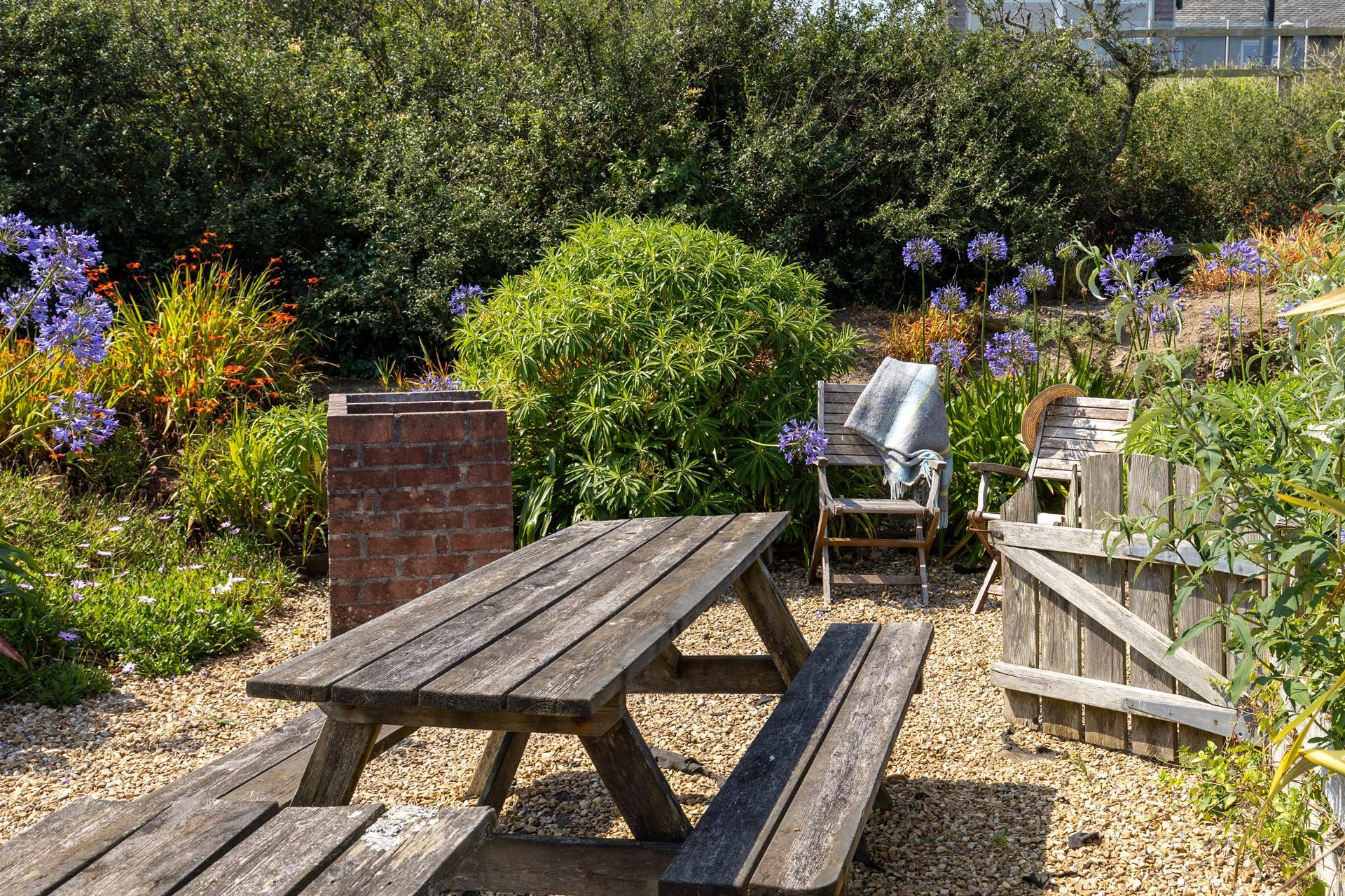 Tucked away, the garden is perfect for al fresco dining!