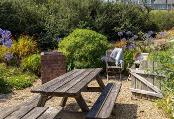 Tucked away, the garden is perfect for al fresco dining!