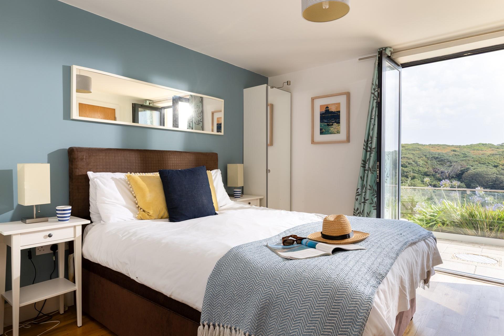 Step from the king bed, straight onto the patio, letting the fresh sea air in.