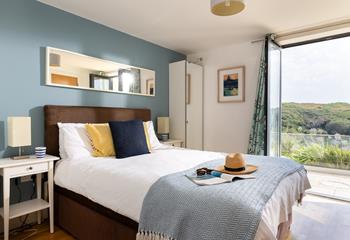 Step from the king bed, straight onto the patio, letting the fresh sea air in.