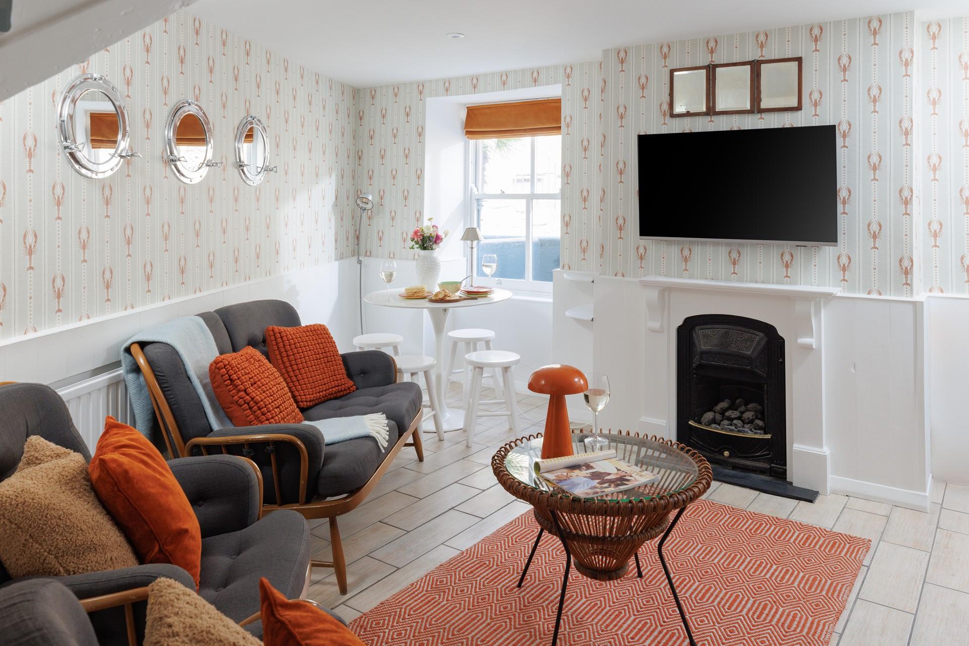 The adorable lounge area offers cosy seating and soothing tones, perfect for relaxing with a glass of something chilled.