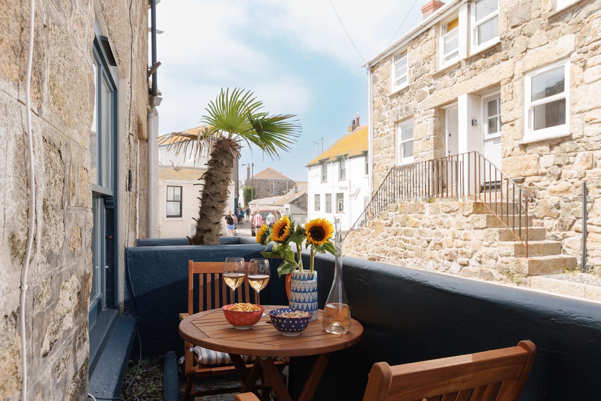 Take wine and nibbles out to the courtyard.