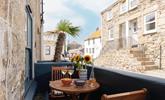 Take wine and nibbles out to the courtyard. - Thumbnail Image