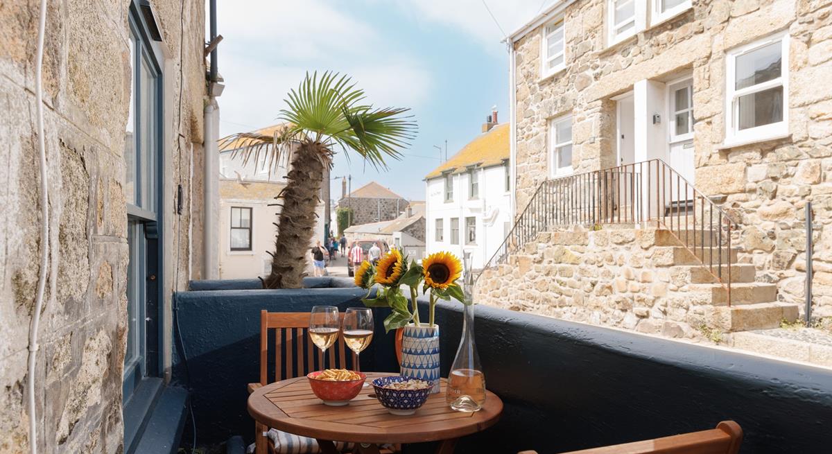 Take wine and nibbles out to the courtyard.