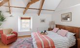 Exposed beams give the main bedroom a characterful and luxurious feel! - Thumbnail Image
