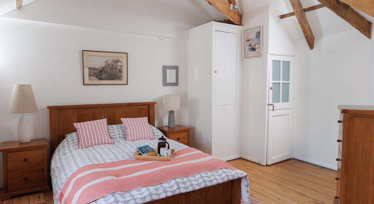 The bedroom is spacious and filled with light.