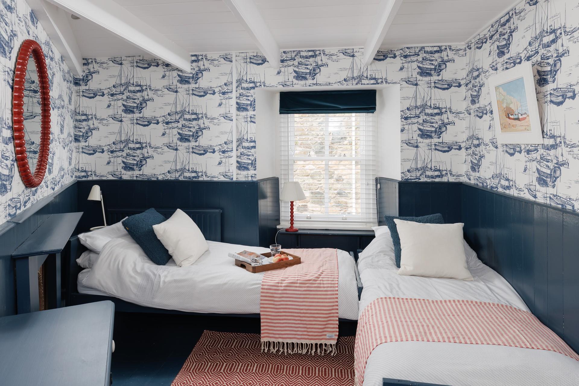 Bedroom 2 boasts stunning nautical themed decor and is perfect for children and adults.