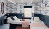 Bedroom 2 boasts stunning nautical themed decor and is perfect for children and adults. - Thumbnail Image