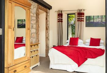 The rural and rustic theme flows throughout the house and gives the bedrooms a distinctly cosy feel.