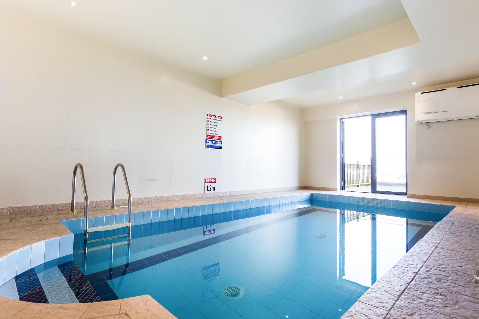 On rainy days, take a dip in the communal pool, included with the apartment.