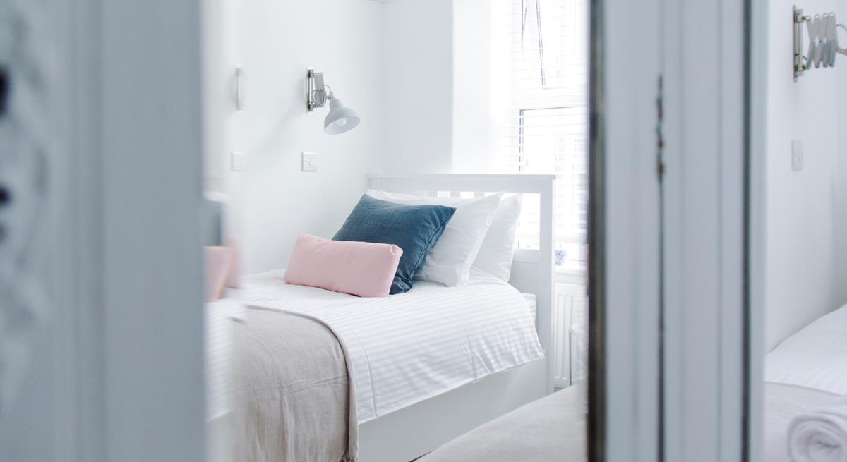 Pastel bedding creates a calming space.