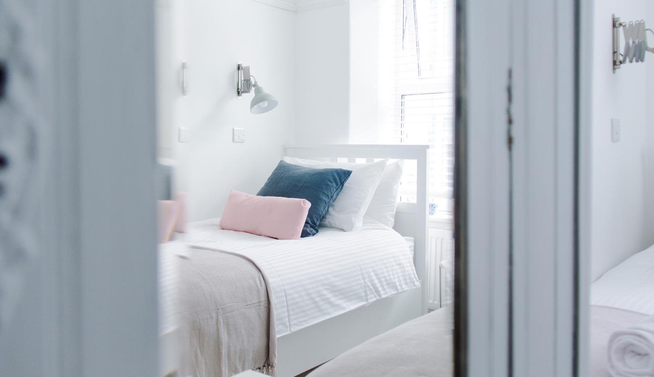 Pastel bedding creates a calming space.