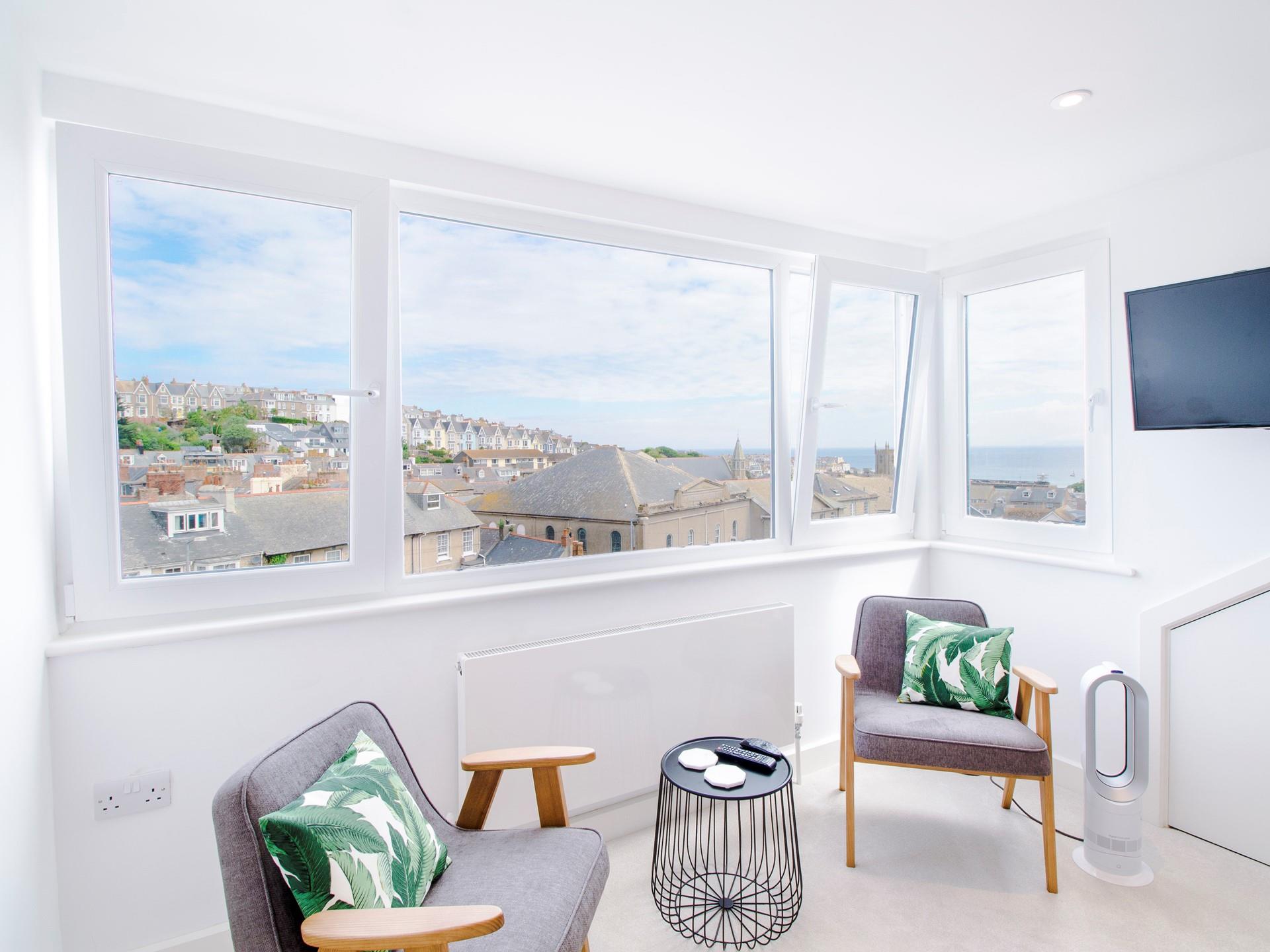 Bedroom 3 has a large dormer window with stunning harbour views. 